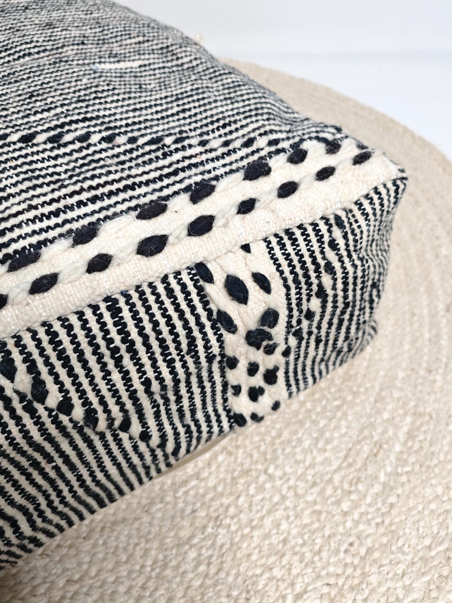 Moroccan vintage pouf, Berber floor cushion with stripes, seat cushion made of beige black wool by hand-knotted