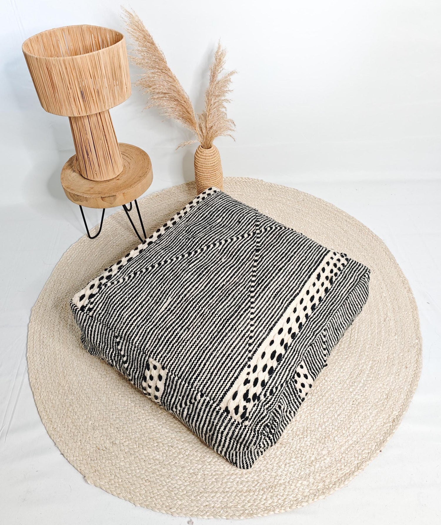 Moroccan vintage pouf, Berber floor cushion with stripes, seat cushion made of beige black wool by hand-knotted